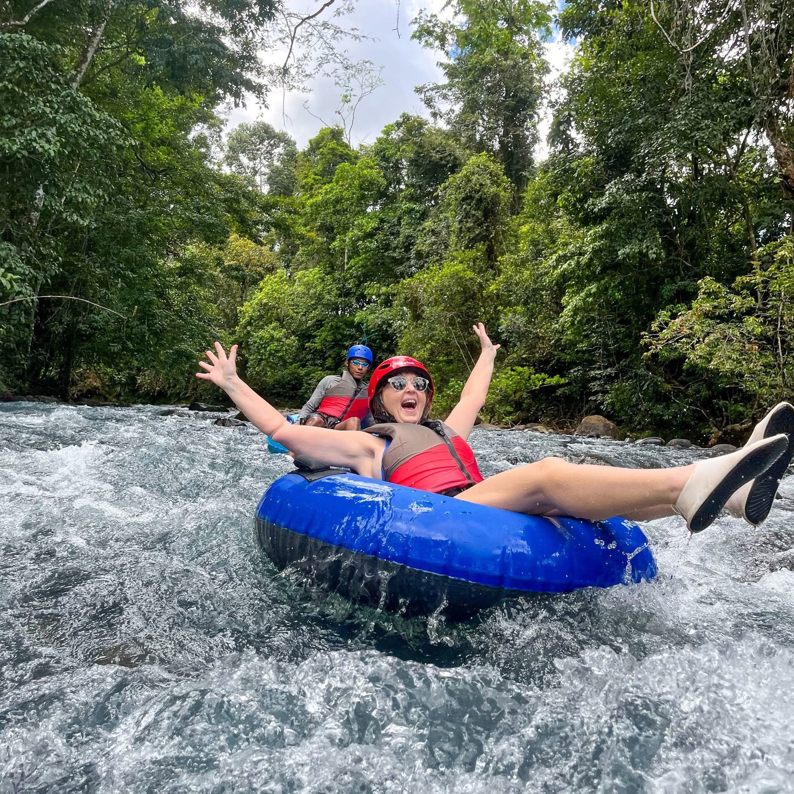 Tourists enjoying rio celeste tubing tour