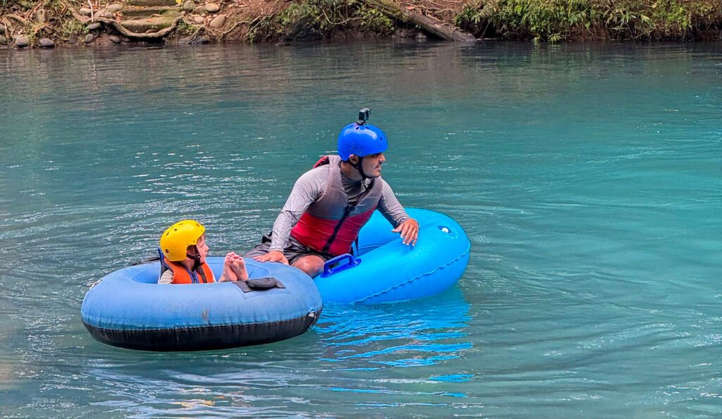 Guides always attentive to kids in Tubing Rio Celeste